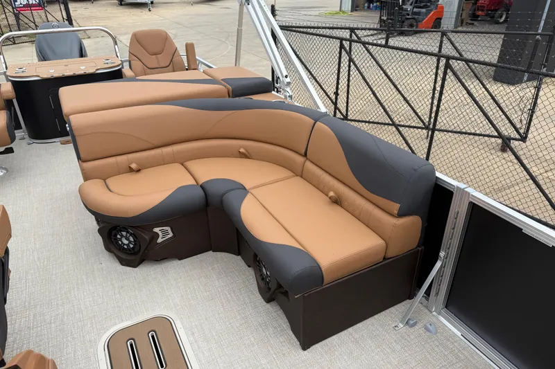 Slide: The Image of Luxurious seating on 2026 Avalon LSZ Rear Fish pontoon boat, featuring tan and black upholstery. - 11