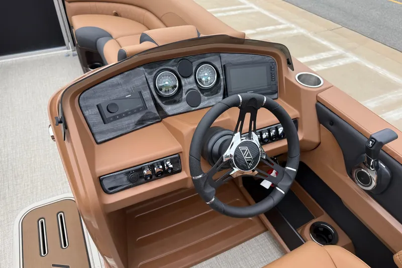 Slide: The Image of 2026 Avalon LSZ Rear Fish boat dashboard with modern controls and steering wheel. - 13