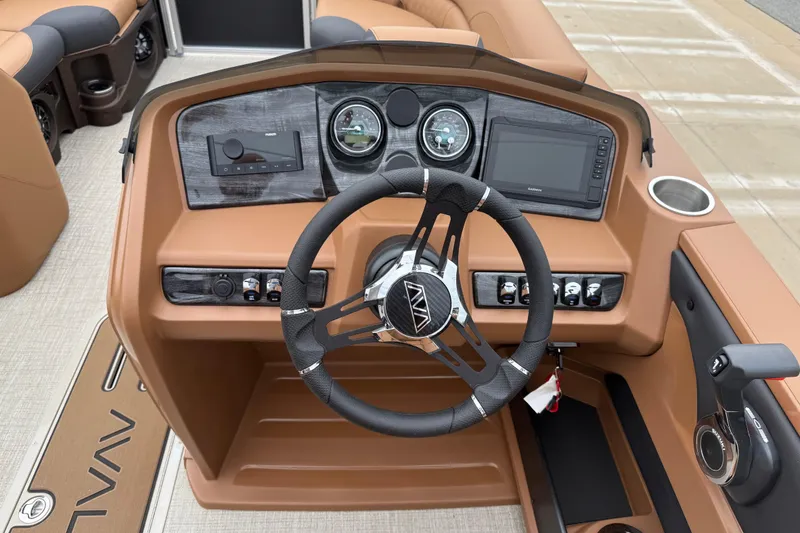 Slide: The Image of Steering console of 2026 Avalon LSZ Rear Fish boat with modern controls and dashboard. - 14