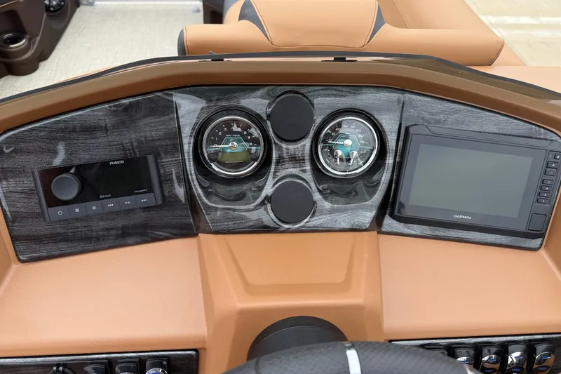 Slide: The Image of Dashboard of 2026 Avalon LSZ Rear Fish boat with gauges and Garmin display. - 15