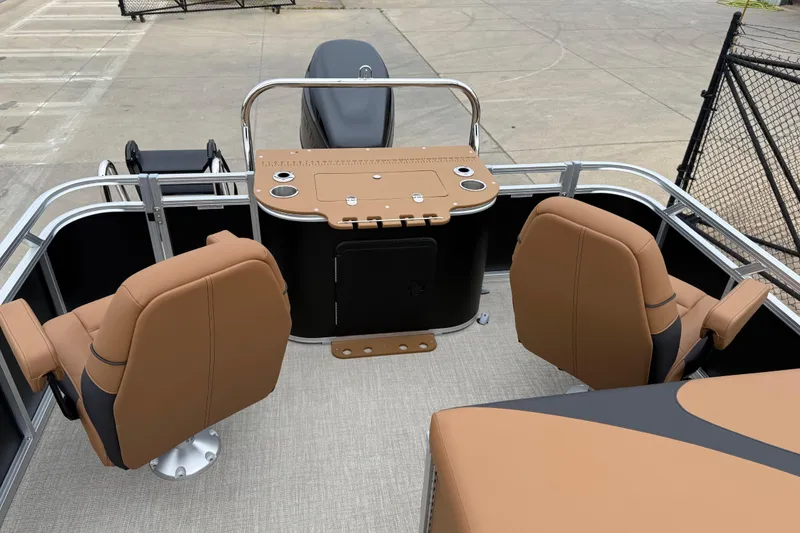 Slide: The Image of 2026 Avalon LSZ Rear Fish boat interior with tan seating and fishing station. - 17