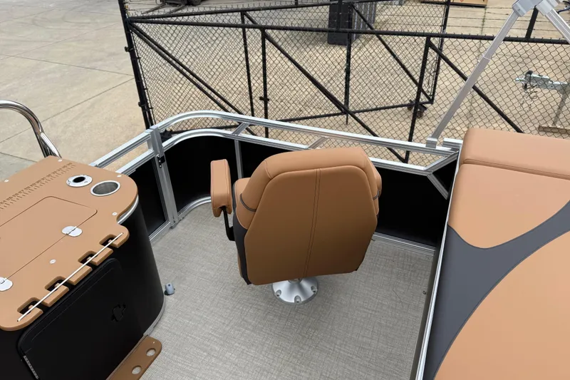 Slide: The Image of 2026 Avalon LSZ Rear Fish boat interior with tan seating and fishing station. - 18