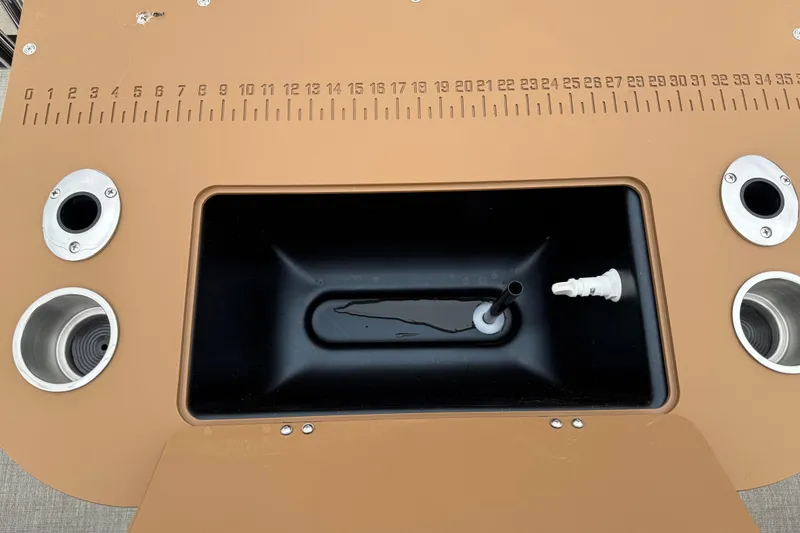 Slide: The Image of Fishing station on 2026 Avalon LSZ Rear Fish boat with built-in ruler and cup holders. - 21