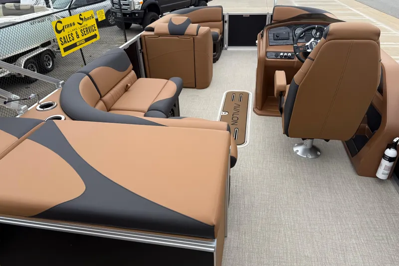 Slide: The Image of Luxurious 2026 Avalon LSZ Rear Fish boat interior with tan and black seating. - 23