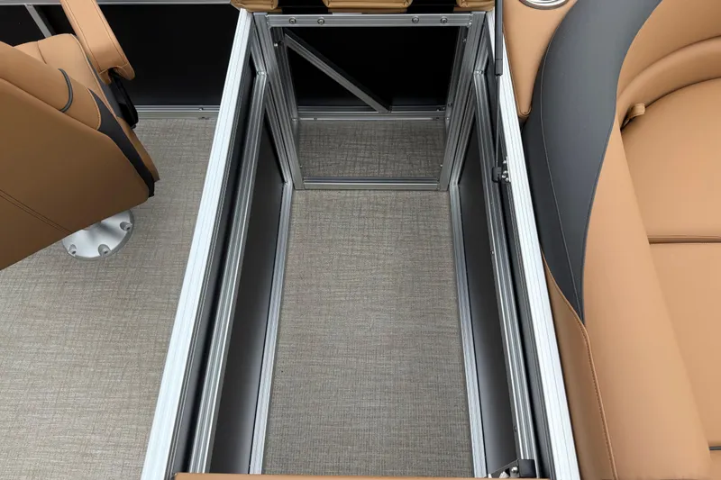 Slide: The Image of 2026 Avalon LSZ Rear Fish boat storage compartment with tan seating and sleek design. - 24