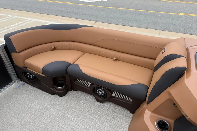 Slide: The Image of Luxurious seating on 2026 Avalon LSZ Rear Fish boat, featuring tan and black upholstery. - 25