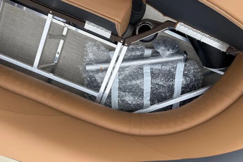 Slide: The Image of Interior view of 2026 Avalon LSZ Rear Fish boat with bubble-wrapped components. - 26