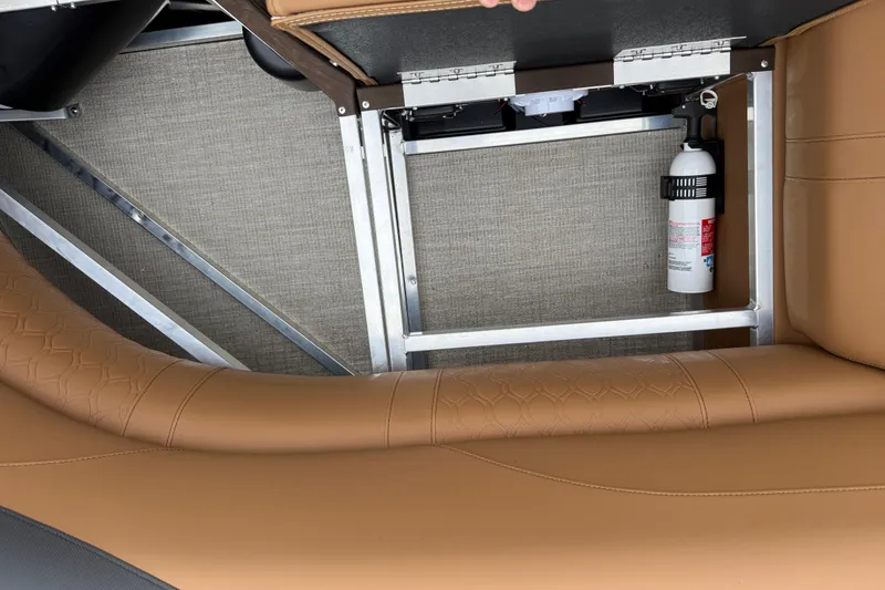 Slide: The Image of 2026 Avalon LSZ Rear Fish boat interior with tan seating and mounted fire extinguisher. - 27