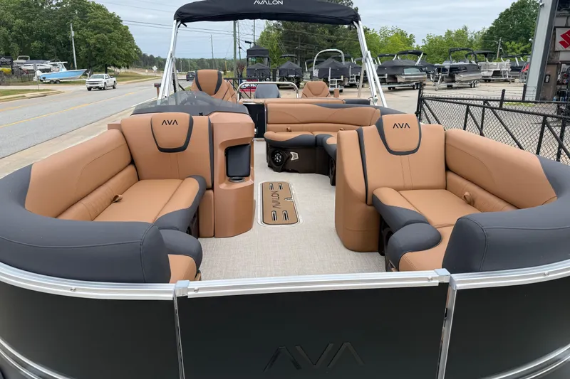 Slide: The Image of 2026 Avalon LSZ Rear Fish pontoon boat with luxurious tan and gray seating. - 6