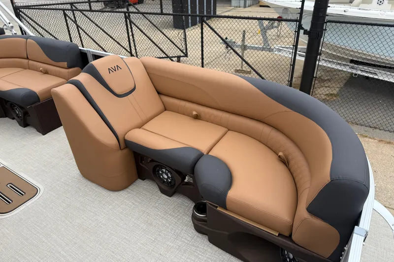 Slide: The Image of Luxurious seating on 2026 Avalon LSZ Rear Fish pontoon boat, featuring tan and black upholstery. - 7