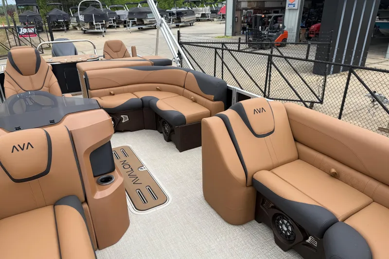 Slide: The Image of Luxurious 2026 Avalon LSZ Rear Fish boat interior with tan and black seating. - 8