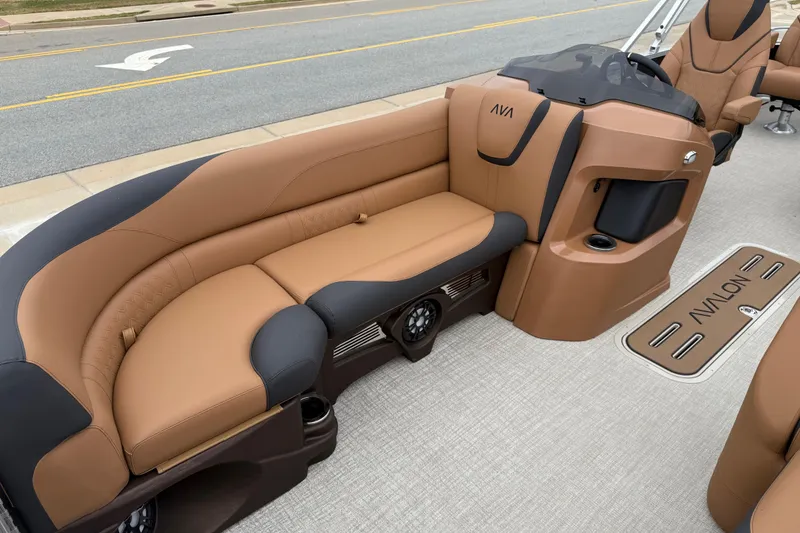 Slide: The Image of 2026 Avalon LSZ Rear Fish boat interior with tan and black seating. - 9