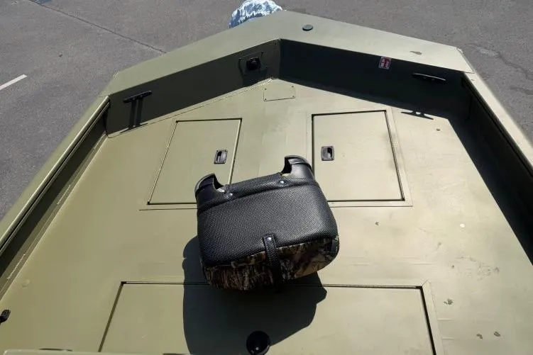 Slide: The Image of 2026 Crestliner 1870 Retriever FCC boat deck with storage compartments and seat. - 4