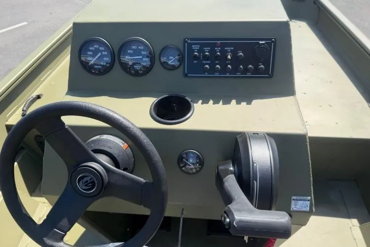 Slide: The Image of 2026 Crestliner 1870 Retriever FCC boat dashboard with steering wheel and control panel. - 6