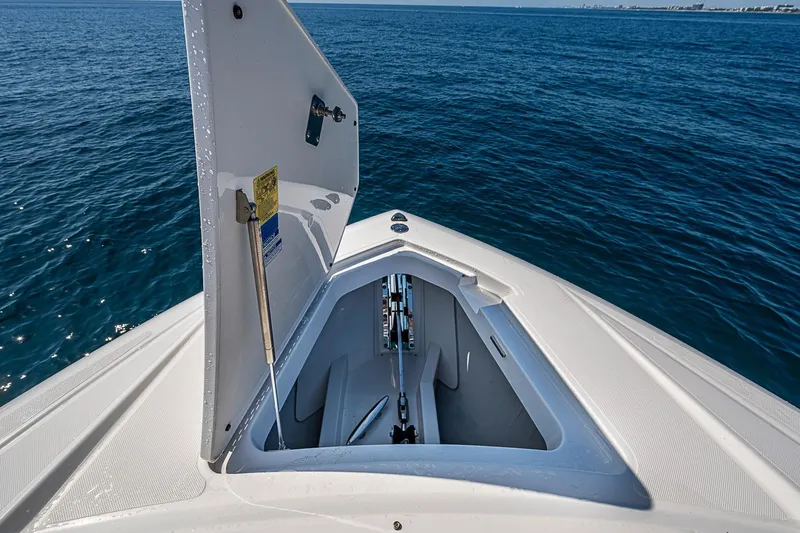 Slide: The Image of Open storage compartment on 2024 Tiara Yachts 48 LS, overlooking the ocean. - 11