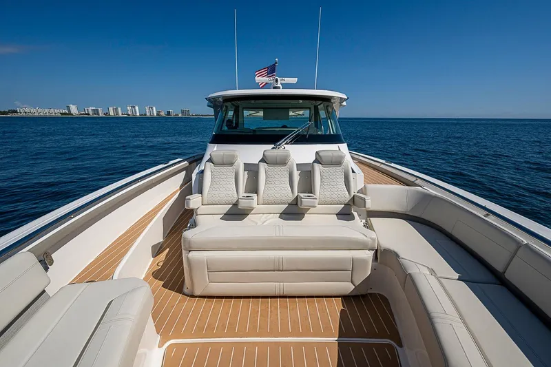Slide: The Image of 2024 Tiara Yachts 48 LS luxury yacht with spacious seating on open water. - 12