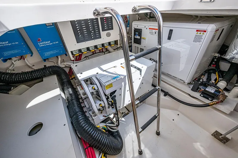 Slide: The Image of Engine room of 2024 Tiara Yachts 48 LS, featuring electrical systems and equipment. - 15