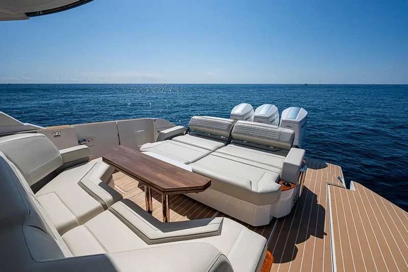 Slide: The Image of 2024 Tiara Yachts 48 LS luxury yacht deck with seating and ocean view. - 20