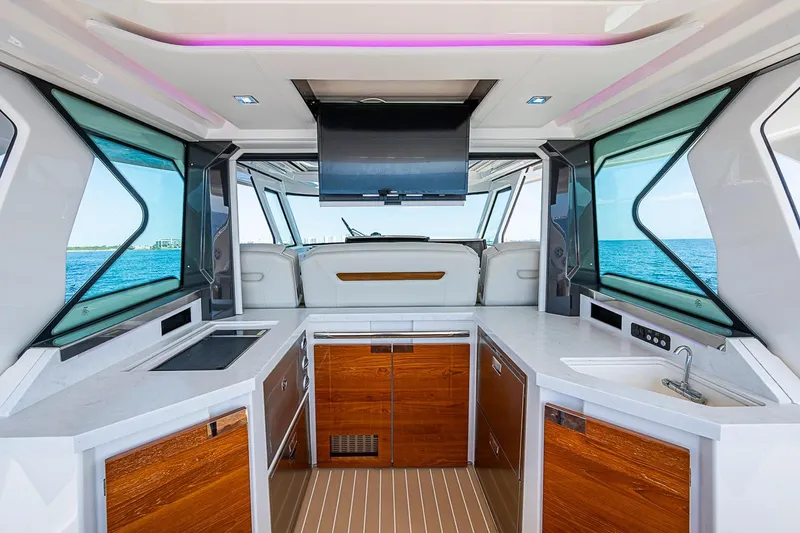 Slide: The Image of Interior of 2024 Tiara Yachts 48 LS with modern kitchen and ocean view. - 27