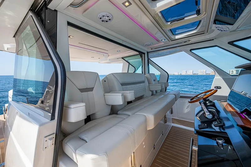 Slide: The Image of Luxurious interior of 2024 Tiara Yachts 48 LS with ocean view and modern helm. - 28