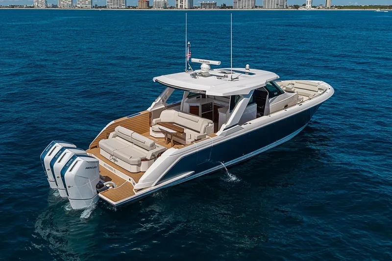 Slide: The Image of 2024 Tiara Yachts 48 LS luxury boat cruising on open water. - 3