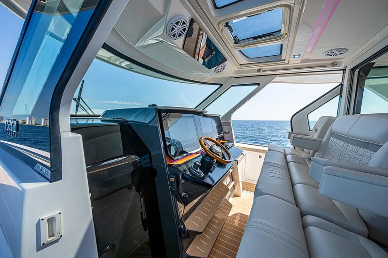 Slide: The Image of Luxurious interior of 2024 Tiara Yachts 48 LS with ocean view and plush seating. - 30