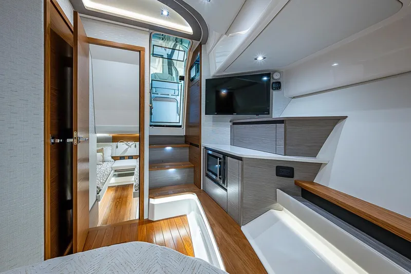 Slide: The Image of Luxurious interior of 2024 Tiara Yachts 48 LS, featuring modern design and elegant wood finishes. - 34