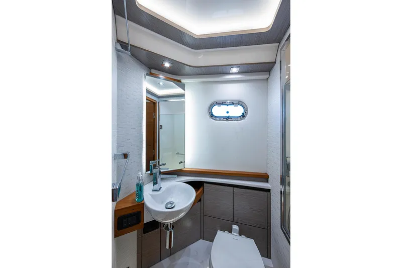 Slide: The Image of Luxurious bathroom interior of 2024 Tiara Yachts 48 LS, featuring modern fixtures and elegant design. - 37