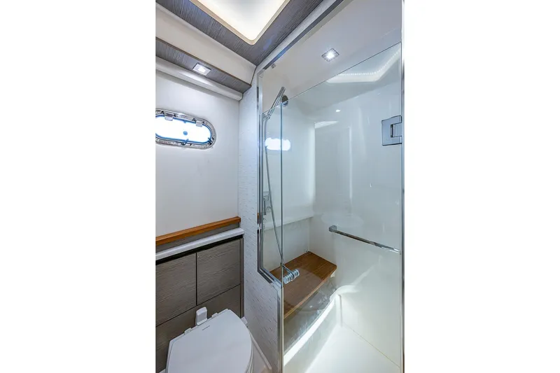 Slide: The Image of Luxurious bathroom in 2024 Tiara Yachts 48 LS, featuring modern shower and sleek design. - 38