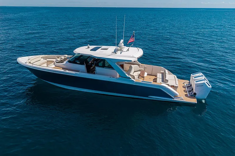 Slide: The Image of 2024 Tiara Yachts 48 LS luxury yacht cruising on open water. - 4