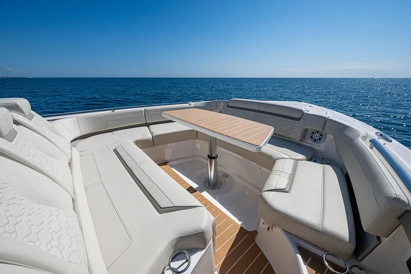 Slide: The Image of Luxurious seating area on 2024 Tiara Yachts 48 LS, overlooking the ocean. - 7