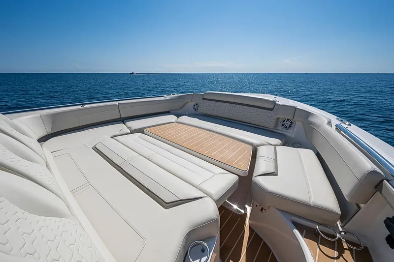 Slide: The Image of Luxurious seating area on 2024 Tiara Yachts 48 LS, overlooking serene ocean waters. - 8