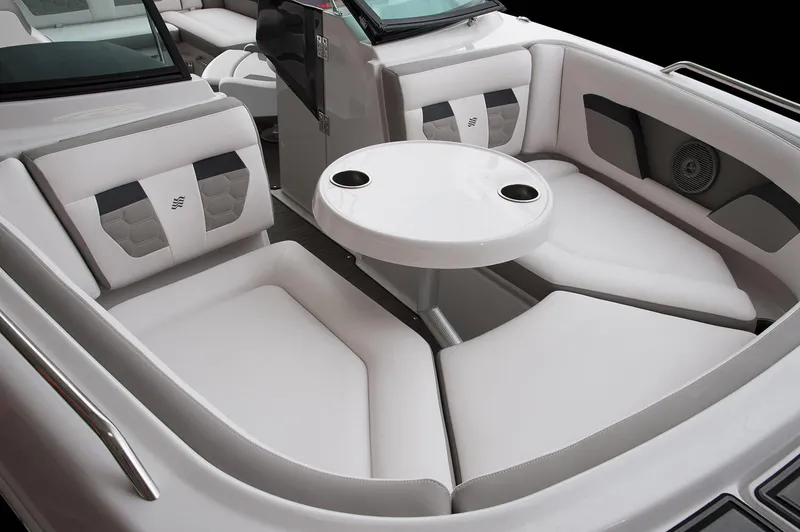 Slide: The Image of Manufacturer Provided Image: 2019 Four Winns HD220 boat interior with white seating and round table. - 12