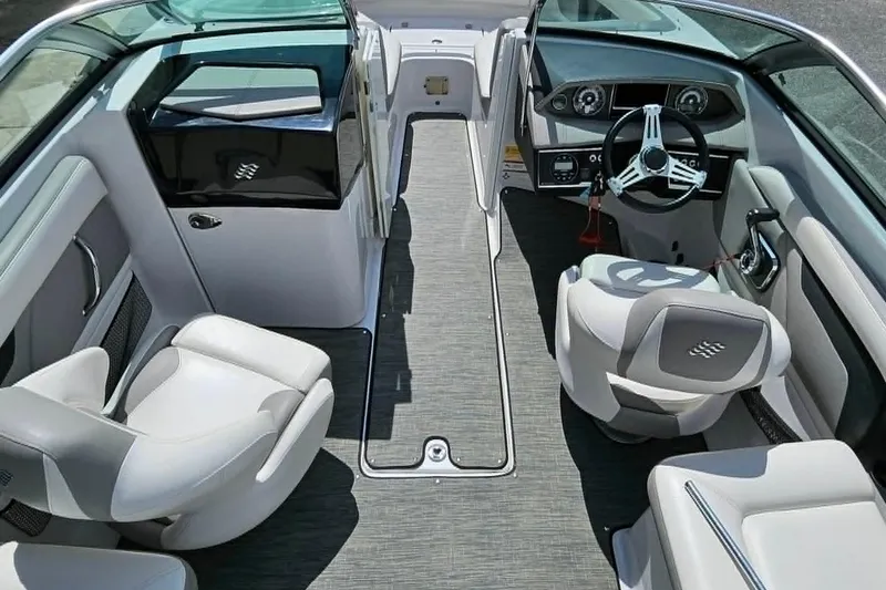 Slide: The Image of 2019 Four Winns HD220 boat interior with modern seating and steering wheel. - 13