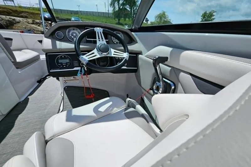 Slide: The Image of Interior of 2019 Four Winns HD220 boat with steering wheel and controls. - 19