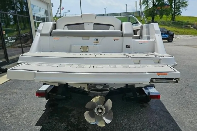 Slide: The Image of 2019 Four Winns HD220 boat rear view with propeller and swim platform. - 20