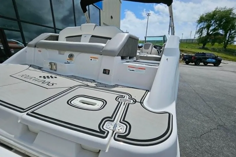 Slide: The Image of 2019 Four Winns HD220 boat rear view with seating and swim platform. - 23