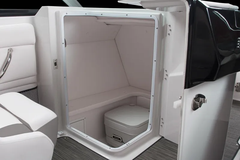 Slide: The Image of Manufacturer Provided Image: 2019 Four Winns HD220 boat interior with a compact marine toilet. - 5
