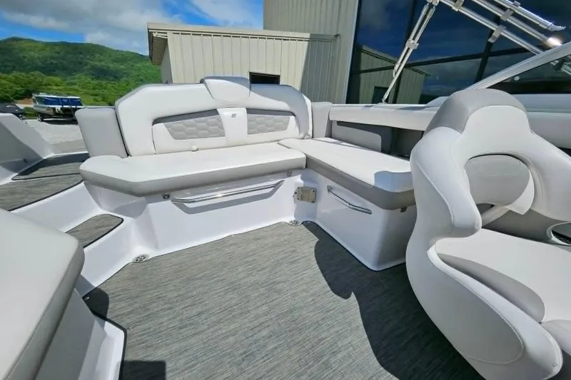 Slide: The Image of 2019 Four Winns HD220 boat interior with plush seating and modern design. - 7