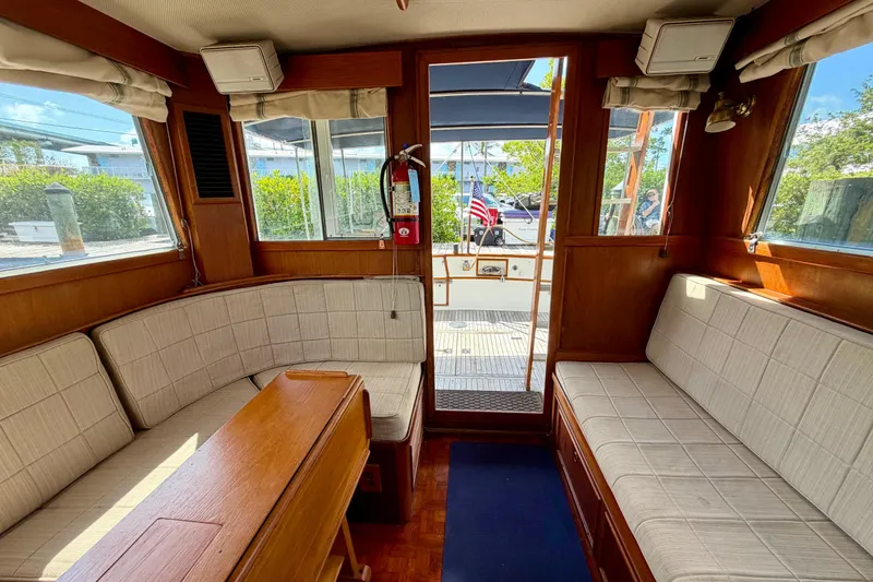Slide: The Image of Interior of 1983 Grand Banks 32 Sedan with wood paneling and cushioned seating. - 31