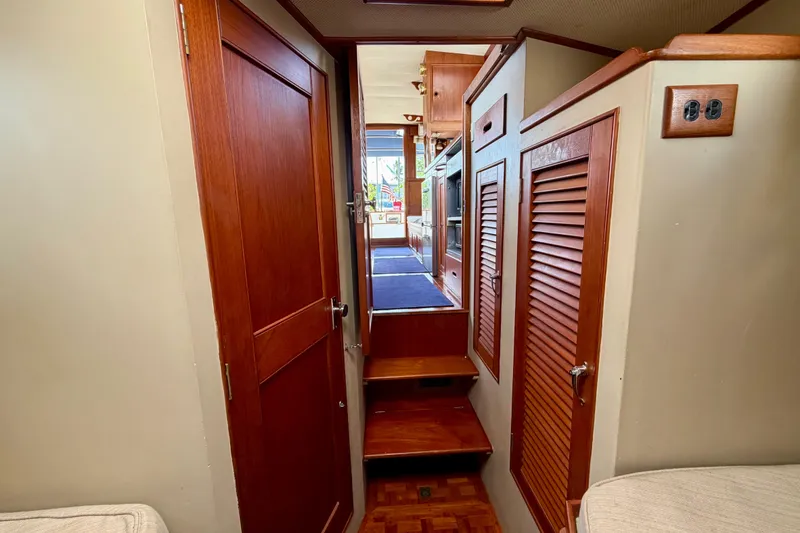 Slide: The Image of Interior view of 1983 Grand Banks 32 Sedan, featuring wooden cabinetry and steps. - 41
