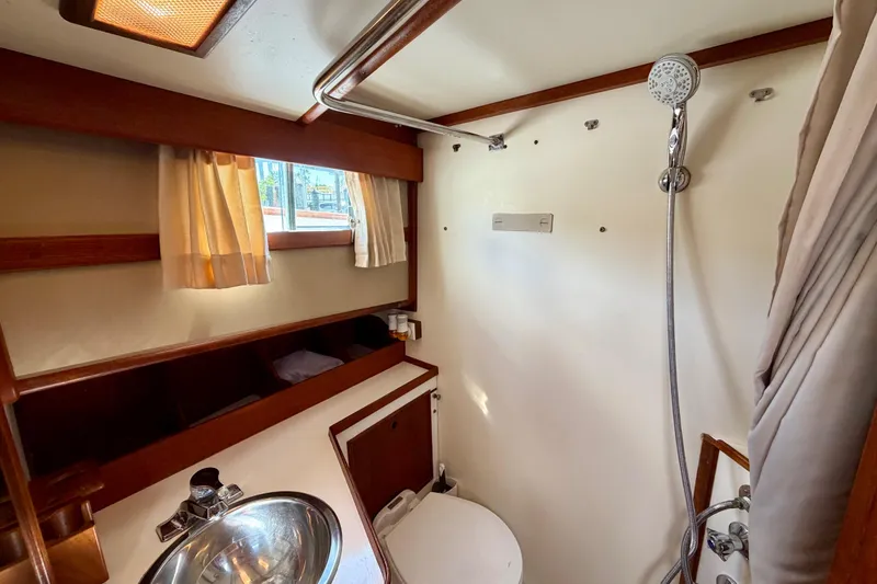 Slide: The Image of Bathroom interior of 1983 Grand Banks 32 Sedan with shower and sink. - 43