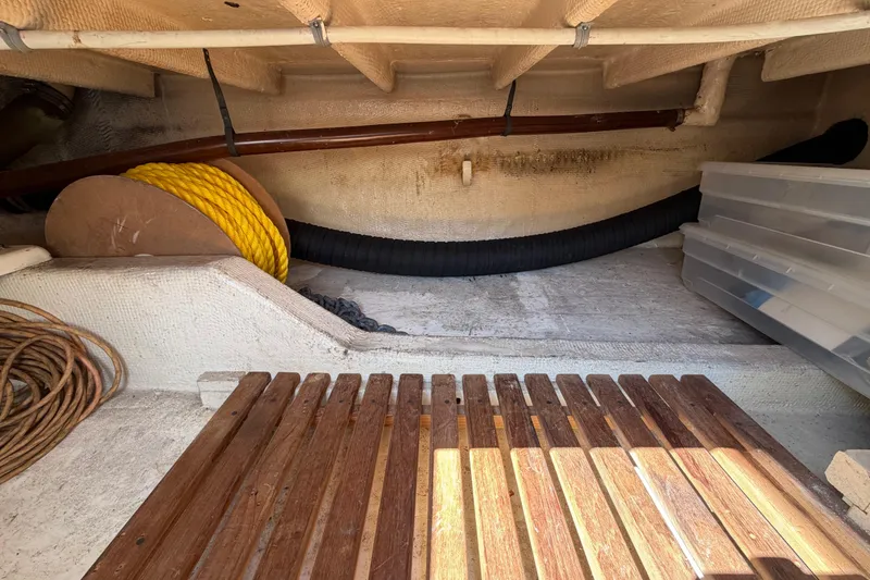 Slide: The Image of Storage area of a 1983 Grand Banks 32 Sedan with ropes and containers. - 50