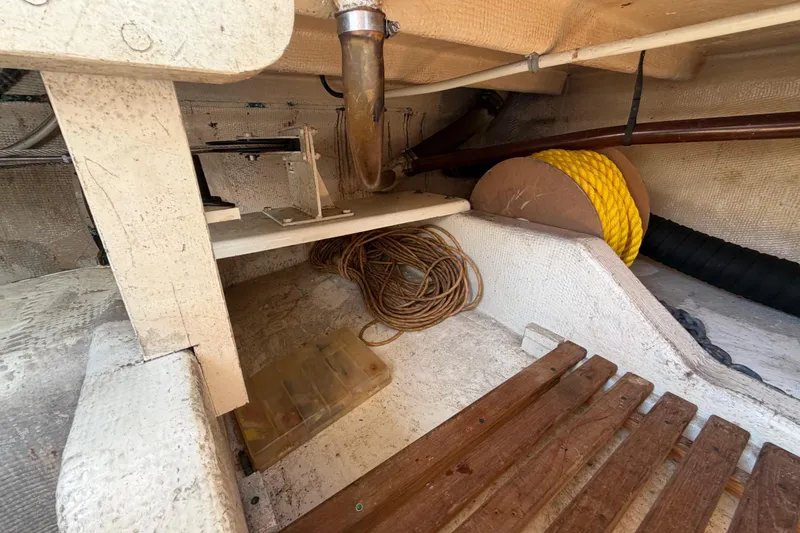 Slide: The Image of Interior storage area of a 1983 Grand Banks 32 Sedan boat with ropes and equipment. - 51