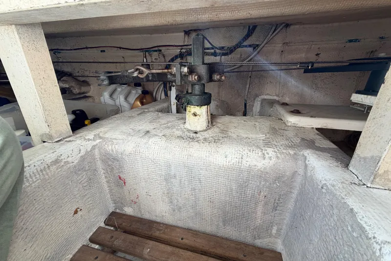 Slide: The Image of Engine compartment of a 1983 Grand Banks 32 Sedan boat, showing mechanical components. - 52