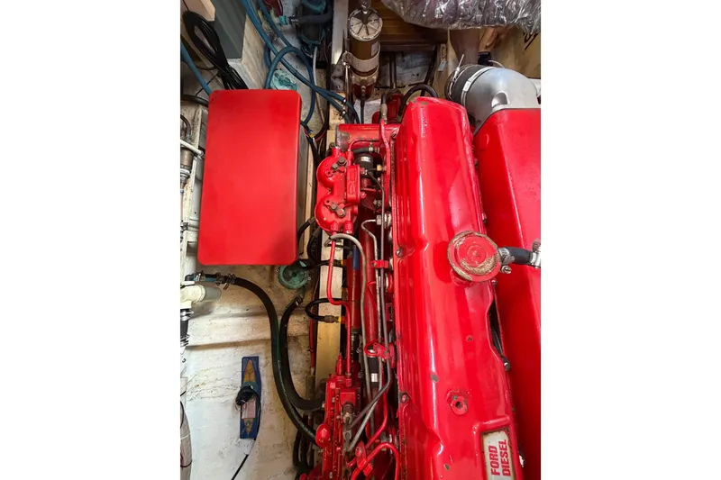Slide: The Image of Red Ford diesel engine in a 1983 Grand Banks 32 Sedan boat. - 57
