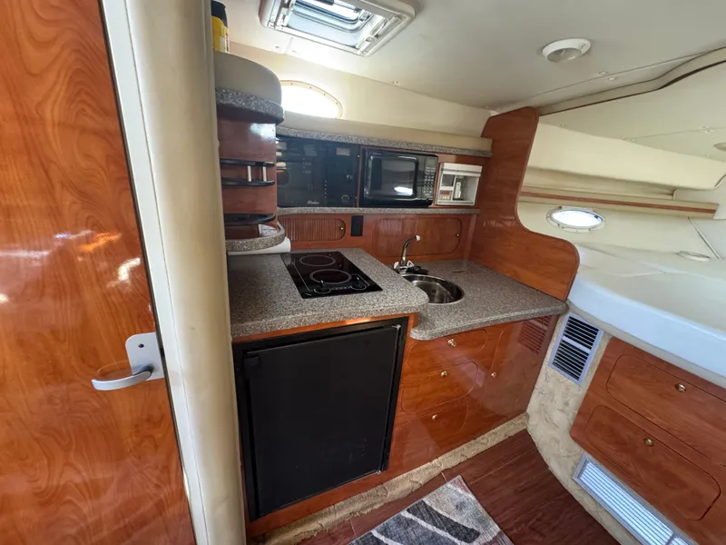 Slide: The Image of Interior of 2005 Rinker Fiesta Vee 342 yacht kitchen. - 14
