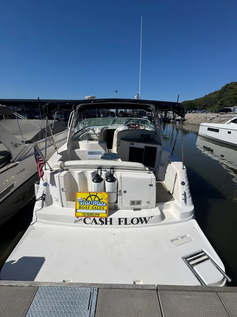 Slide: The Image of 2005 Rinker Fiesta Vee 342 boat docked at marina. - 2