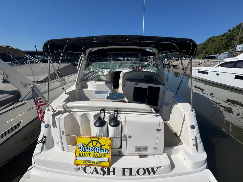 Slide: The Image of 2005 Rinker Fiesta Vee 342 boat docked with sales sign. - 4