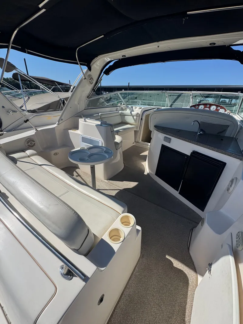 Slide: The Image of Interior of a 2005 Rinker Fiesta Vee 342 yacht with seating area. - 6